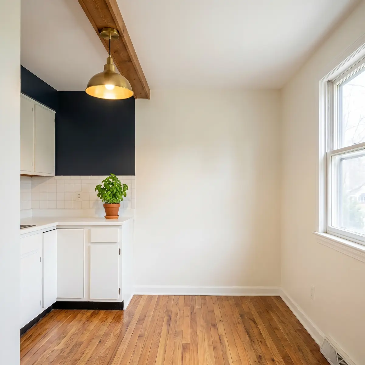 Modern kitchen warm white walls navy accent after painting Bedford NH